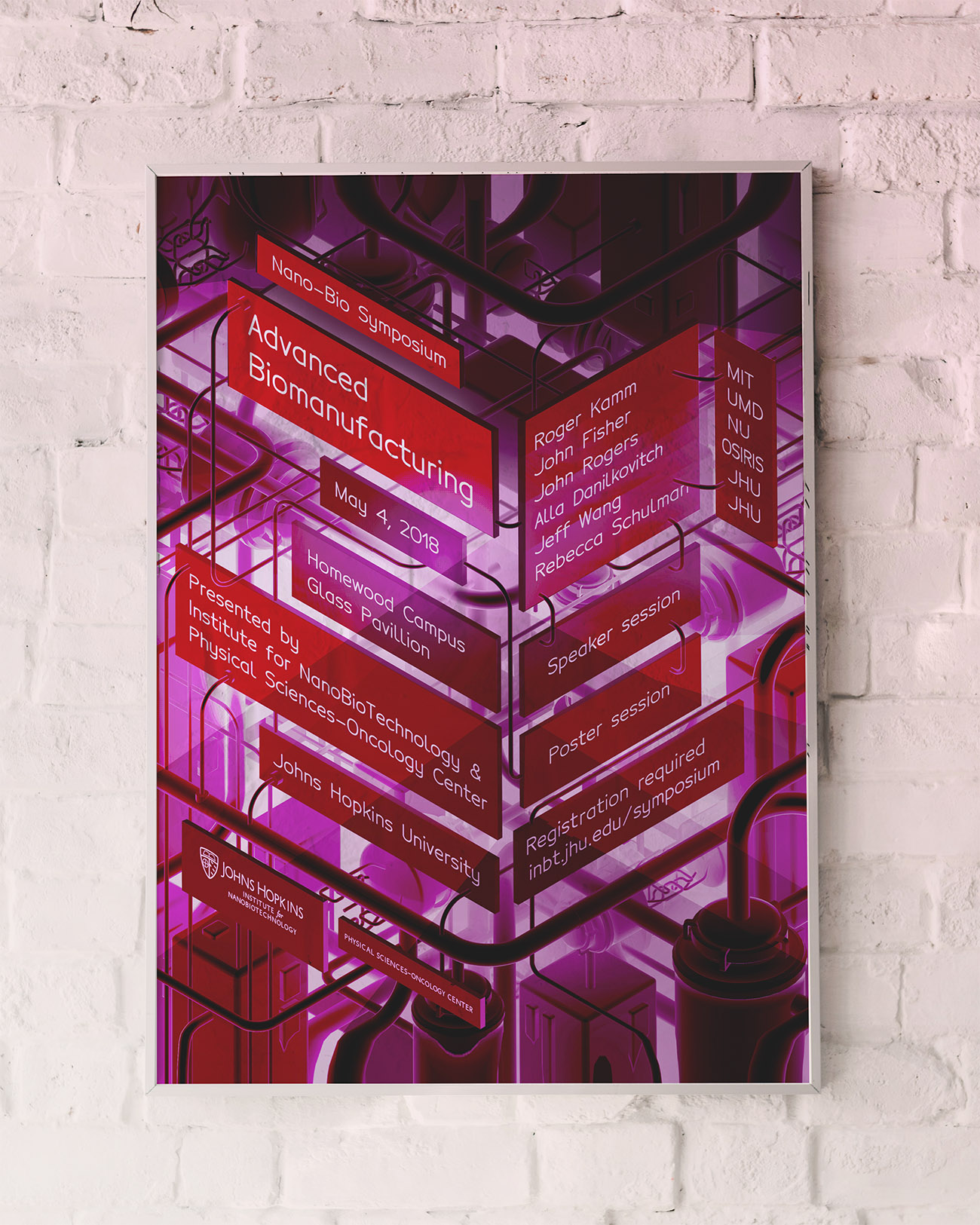a poster for the johns hopkins university institute for nanobiotechnology annual symposium 2018 hanging in a frame on a wall